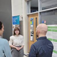 a group of people around a senior project